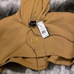 Brand new , Ivy park Adidas cropped hoodie. Tags still on sweatshirt.